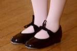 Young girl in tap shoes.