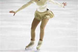 A young girl figure skating